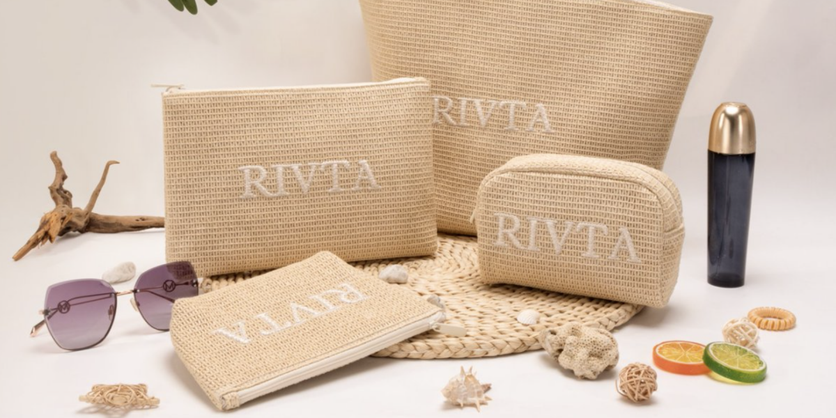 Custom logo and zipper pull detail on a Beauty cosmetic bag