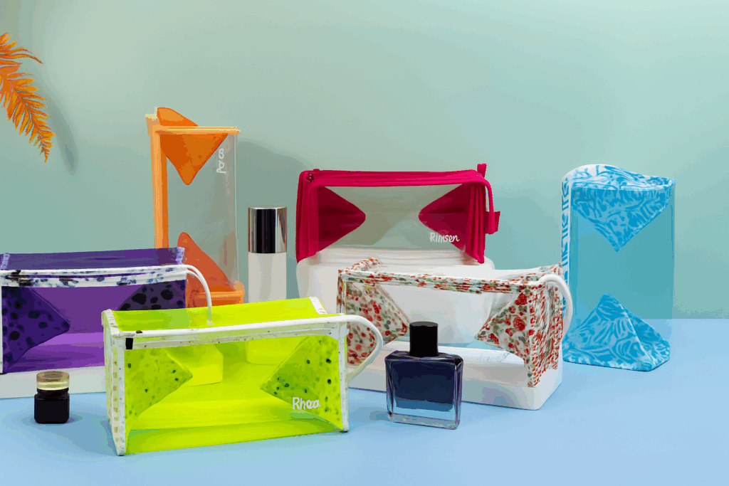 a collection of custom logo makeup bags in various styles and materials