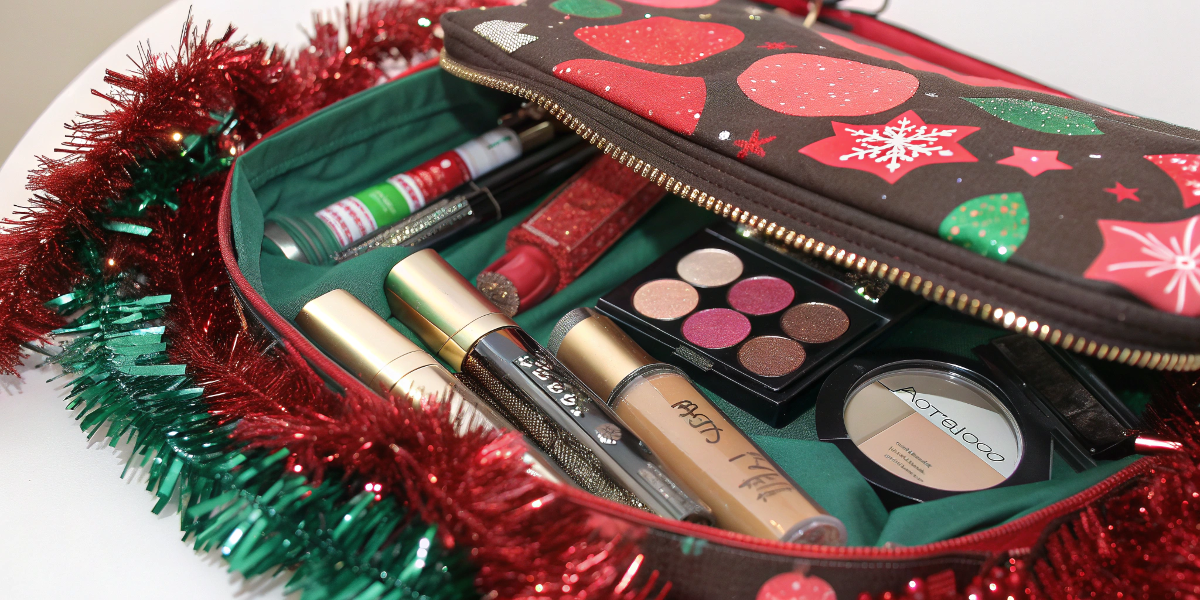 a festive makeup bag filled with holiday-themed beauty products