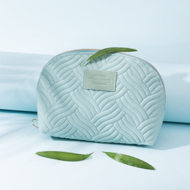 Bamboo quilt toiletry bag showing soft material and volume route