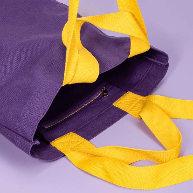 Interior detail of a premium custom canvas bag with a zippered pocket.