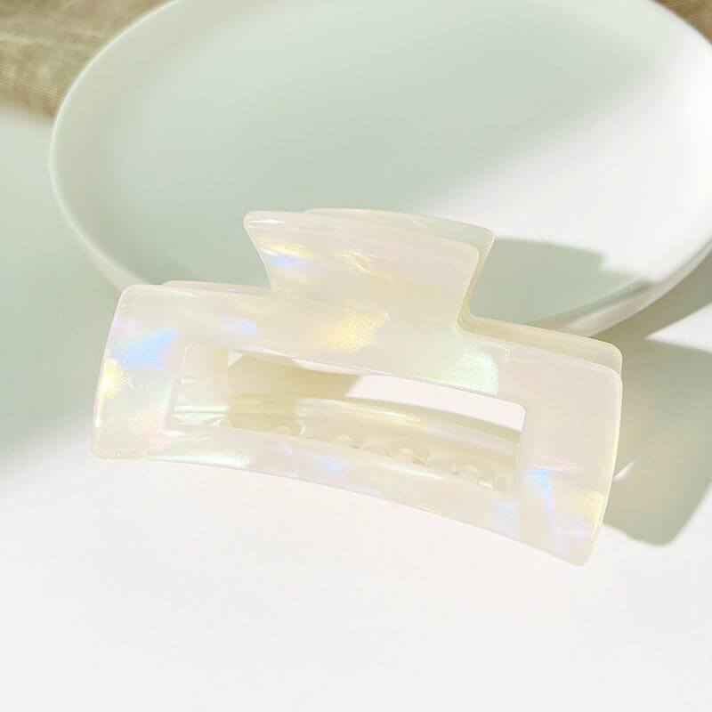 Pearlized white cellulose acetate claw clip for color and shape approval