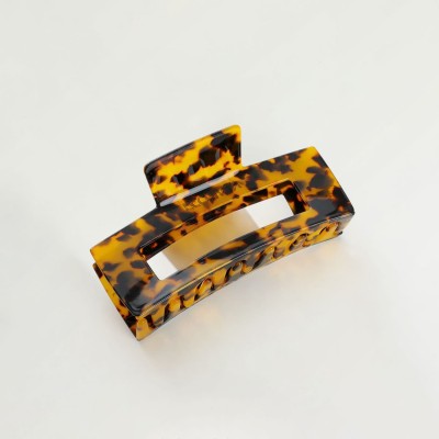 Dark tortoise acetate clip showing pattern range and shape approval needs