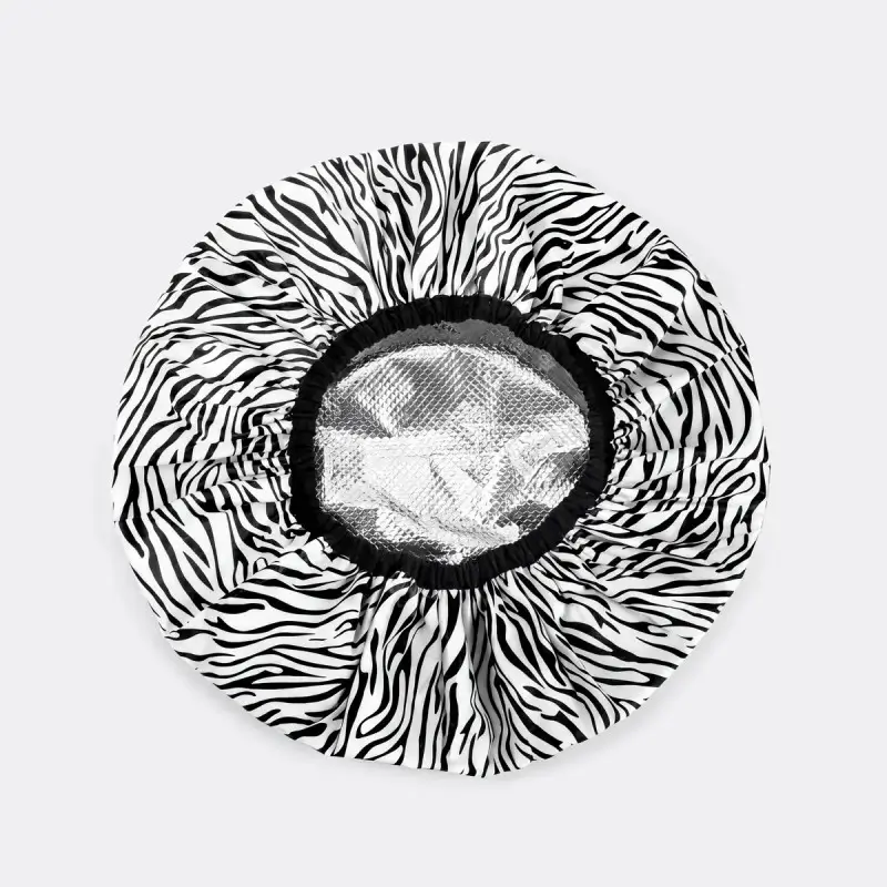 Patterned lined shower cap for spa and salon programs