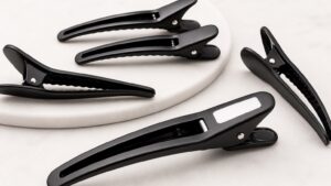 Black creaseless hair clip finish visual reference for white logo and scratch approval