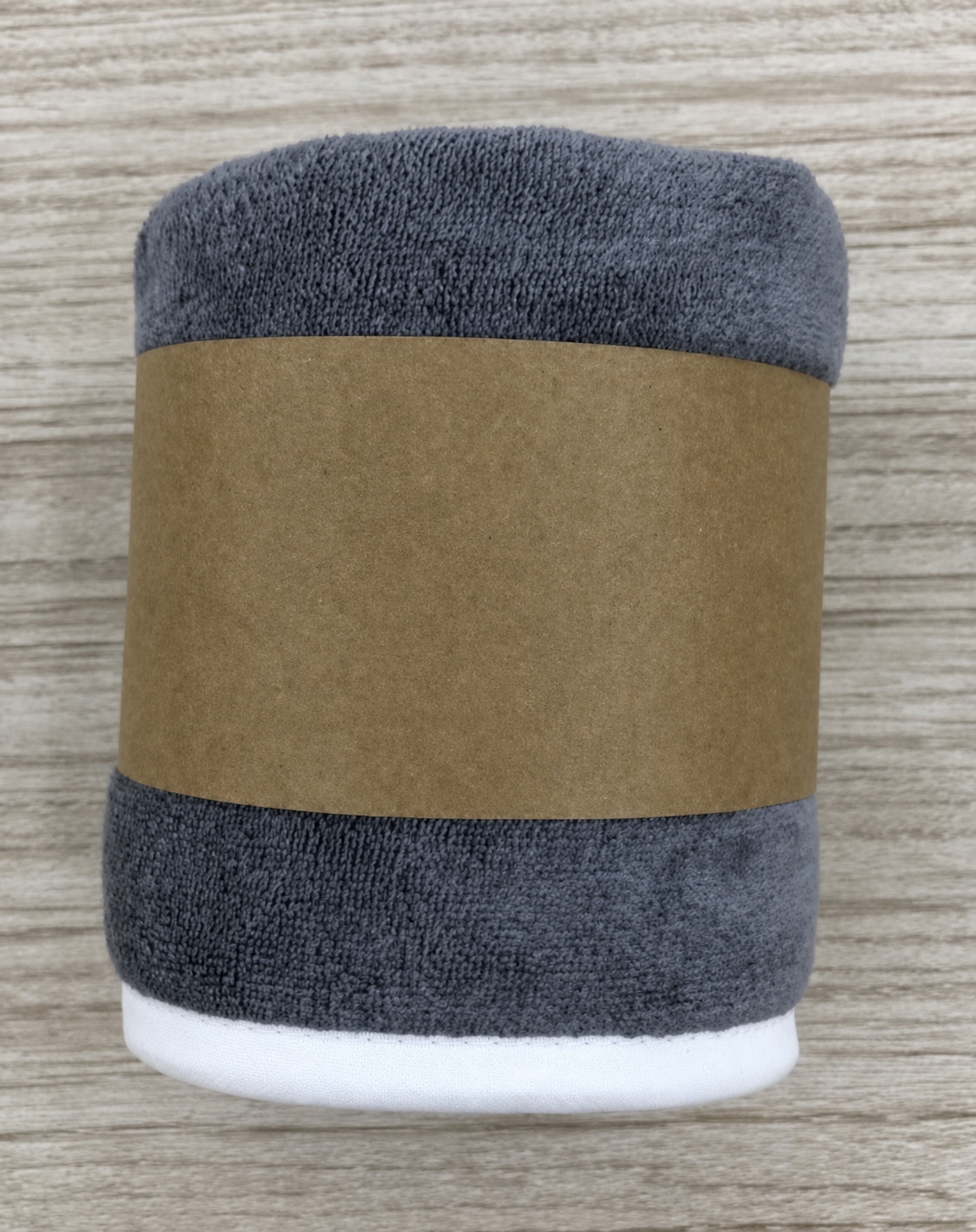 Anonymized microfiber hair turban packed with a plain kraft paper sleeve