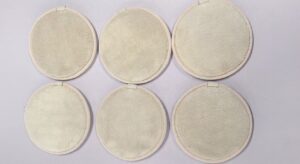 Actual 12 cm round white coral-fleece cleansing pads from the 3,200-piece order