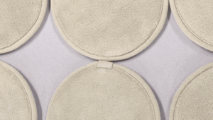 Round reusable cleansing pads showing the bound edge and two-layer construction