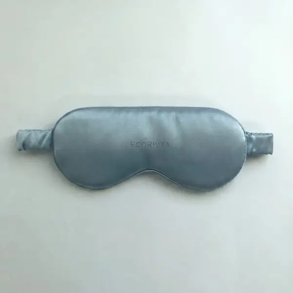 Blue silk eye mask showing centered embroidery placement for a 3,500-piece project