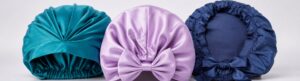Three silk-or-satin hair wrap sample routes showing edge band, bow closure and inner cap depth