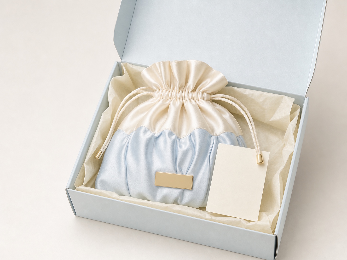 Ruched satin GWP pouch in pale blue gift box with tissue and blank card
