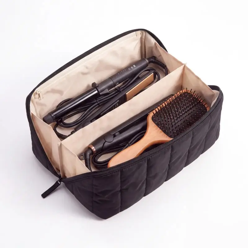Sectioned hair tool organizer reference showing separate tool and cord spaces